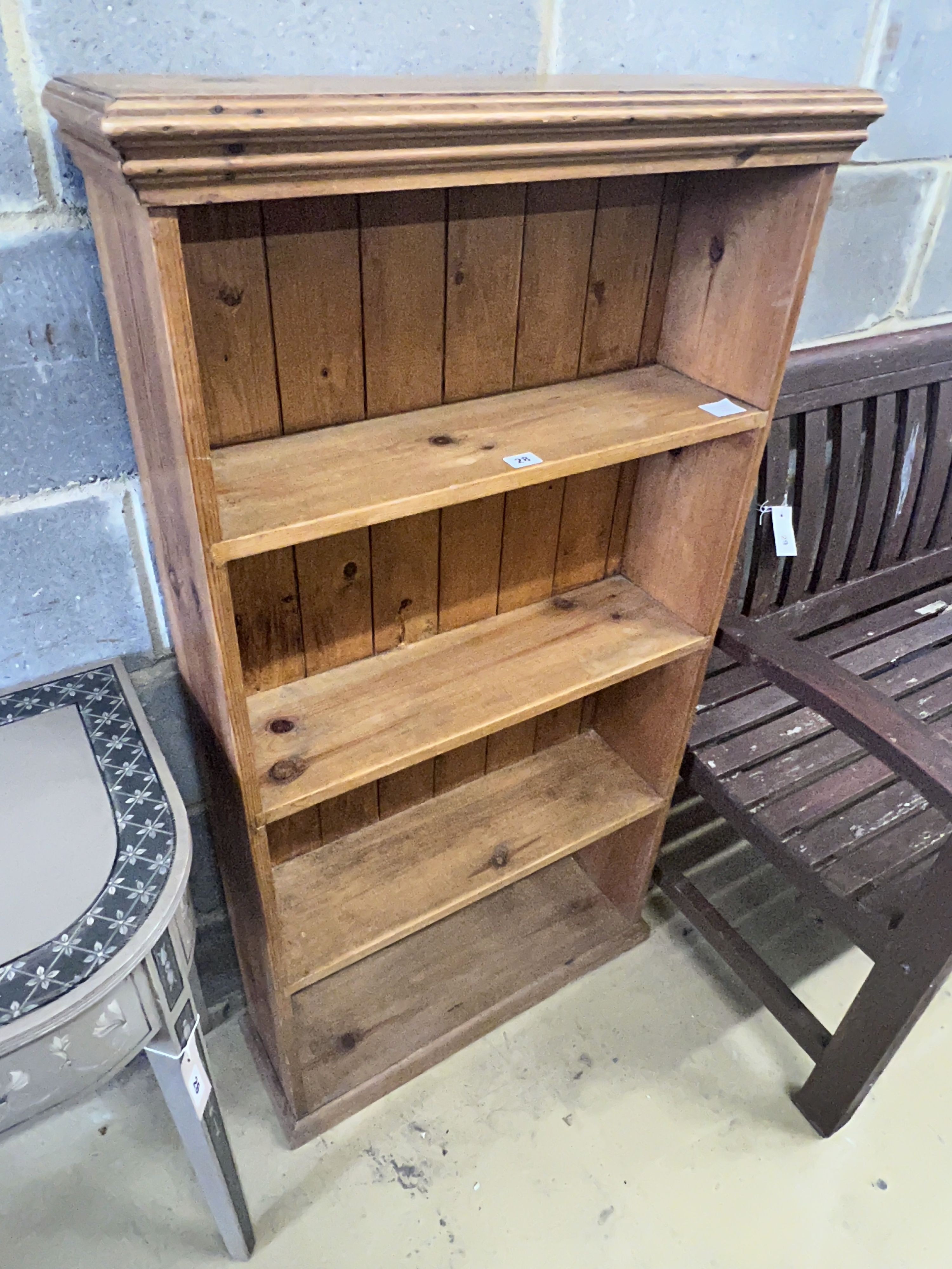 A pine open bookcase, width 66cm depth 21cm height 125cm